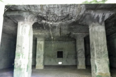 Bomb damage inside the warehouse on Etten island, Chuuk (Truk) Lagoon.