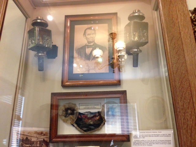 Lincoln's carriage lamps and funeral train ribbon.