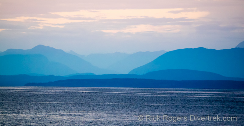 Sunset over the mountains in the Strait of Georgia.
